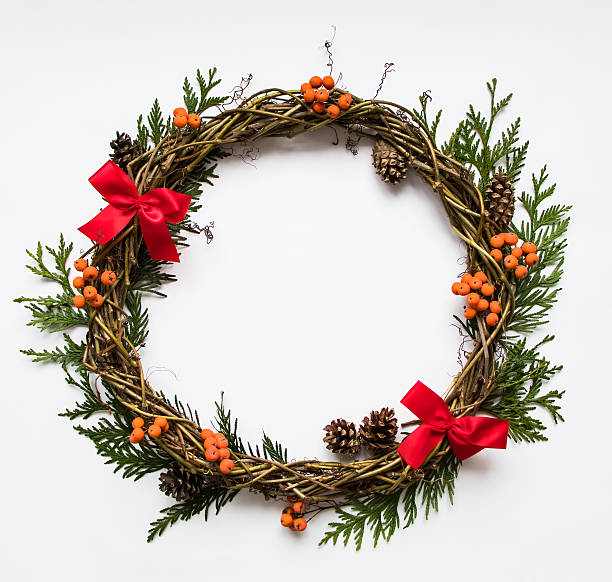 istock Wreath of vines with decorative bows, thuja, rowanberries. Flat lay 624394824