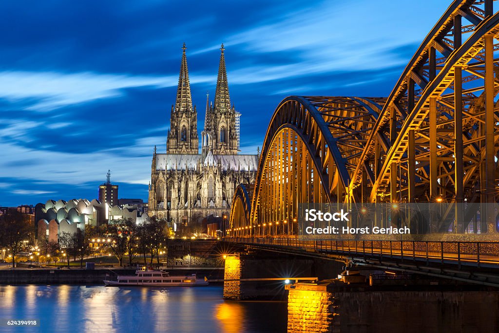 Cologne Cathedral at night, Germany Cologne Cathedral with Hohenzollern Bridge at night. Cologne Stock Photo