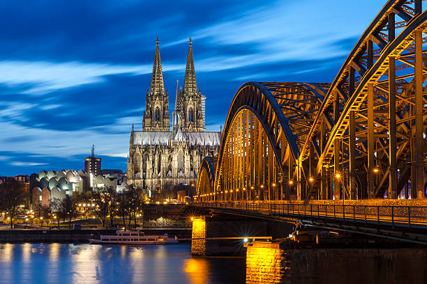 Cologne Cathedral at night, Germany Cologne Cathedral with Hohenzollern Bridge at night. rhine river photos stock pictures, royalty-free photos & images