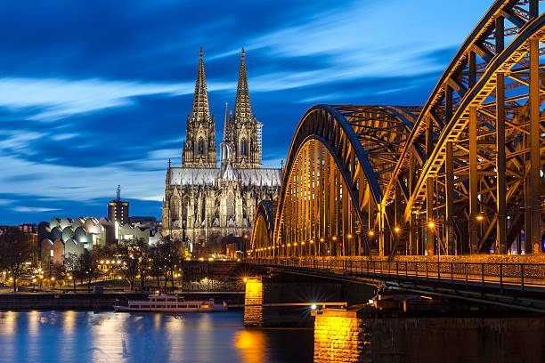 Cologne Cathedral at night, Germany Cologne Cathedral with Hohenzollern Bridge at night. cologne stock pictures, royalty-free photos & images