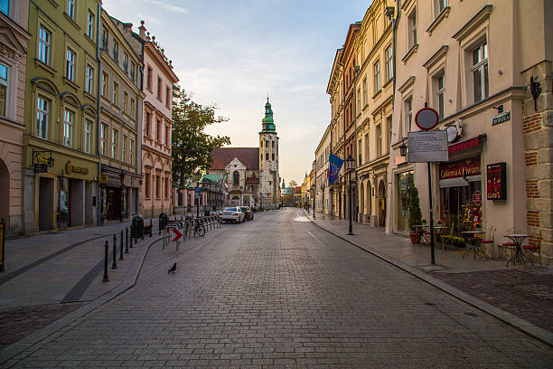 Krakow, Poland - October 15, 2016: A view along Grodzka street in Krakow during the morning. The outside of buildings and people can be seen.