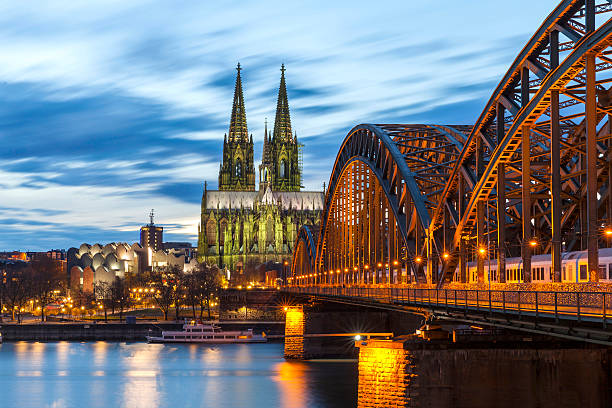 Cologne Cathedral at night, Germany Cologne Cathedral with Hohenzollern Bridge at night. koln germany stock pictures, royalty-free photos & images