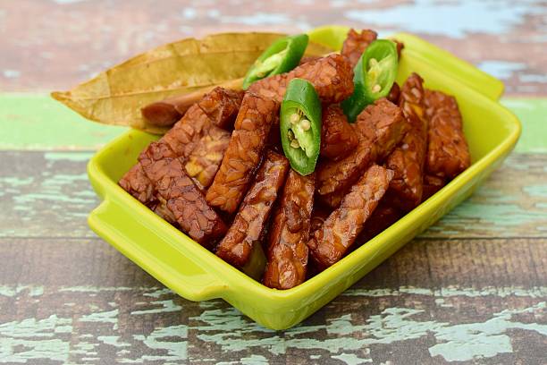 Tempeh soy sauce Indonesian food. Tempeh, fermented soybeans season with with soy sauce and green chili tempe arizona stock pictures, royalty-free photos & images