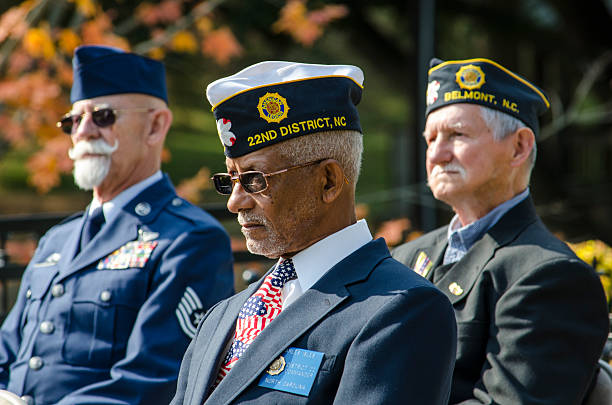 American Veterans Honored at a Veteran’s Day Cermony Belmont, North Carolina, USA - November 11, 2016: United States Veterans of foreign wars were honored at a Veteran’s Day ceremony in Belmont, North Carolina to those who served and currently serve in the armed forces. The ceremony was proud to honor Veteran’s from World War II, The Korean War, The Vietnam War and those who serve and have served in the Middle East and Afghanistan. veteran photos stock pictures, royalty-free photos & images