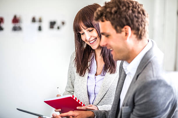 istock Young business people discussing in office 624409232
