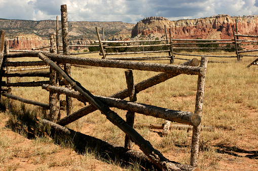 Wooden corral and sandstone mountains in New Mexico, USA