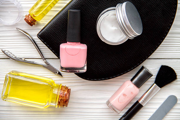 istock set for manicure and make-up on wooden background 624426108