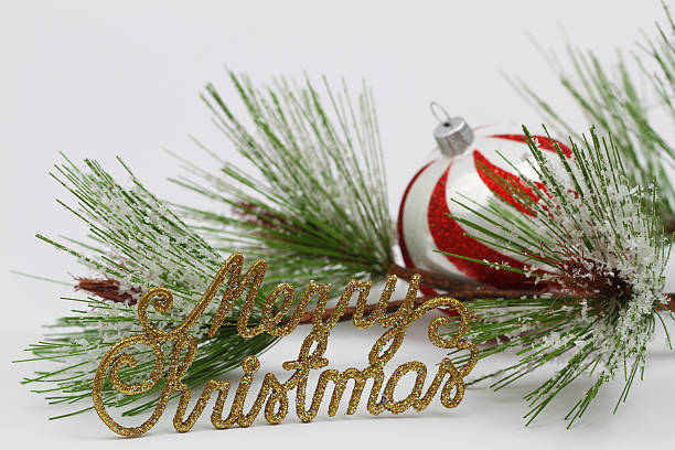 istock Merry Christmas written with golden letters, pine and bauble 624427792