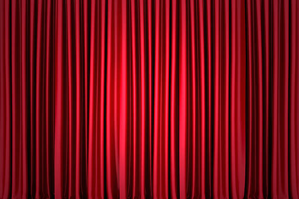 istock Red silk stage curtain on theater 624432854