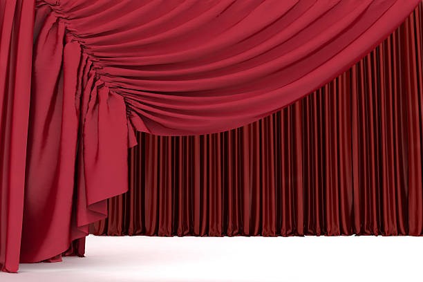 istock Open crimson theater curtain with light and shadows 624432898
