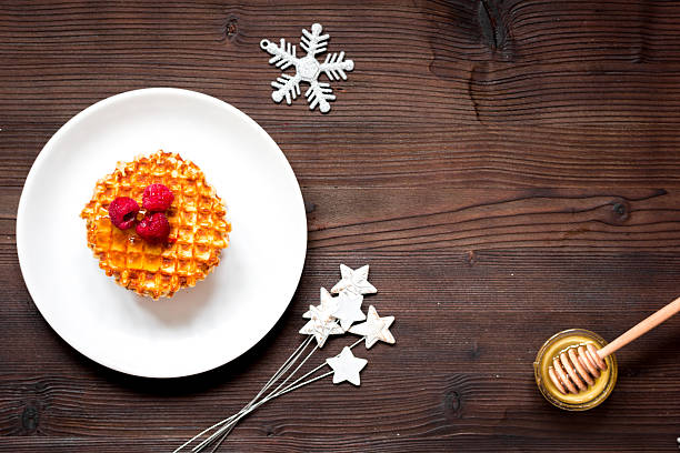 istock Christmas breakfast with waffles top view 624434974