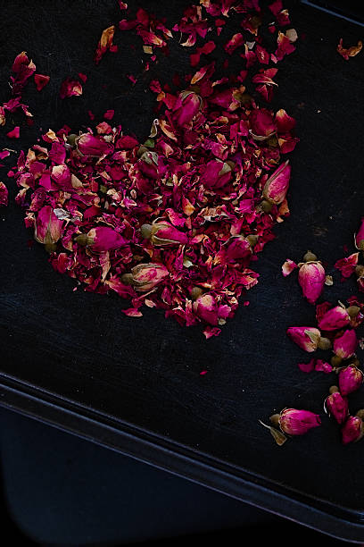 istock Dried rose petals in heart shape 624436784