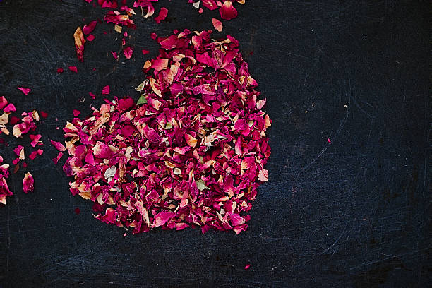 istock Dried rose petals in heart shape 624436870