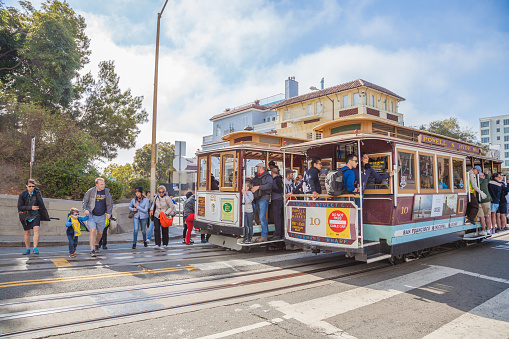 San Francisco, California, United States - August 16, 2016: Two Cable Car, Powell-Hyde lines stopped at intersection between Hyde and Lombard Street, popular touristic attraction.