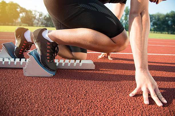 istock Male athlete on starting position at athletics running track. 624438202
