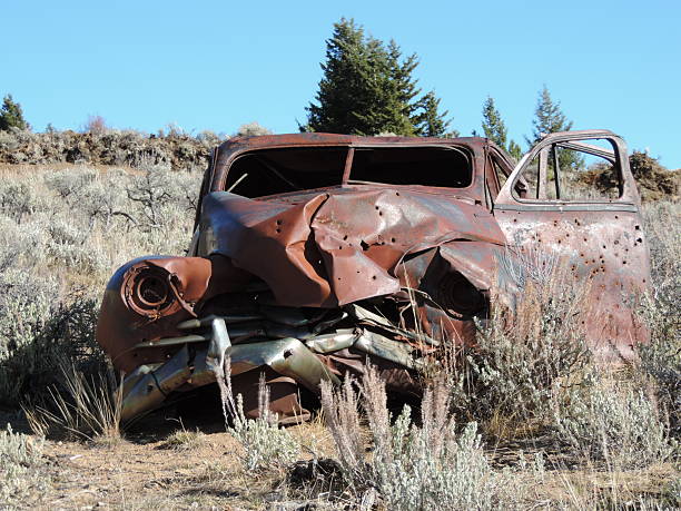 istock Old Rusty Car with Bullet Holes. 624439786