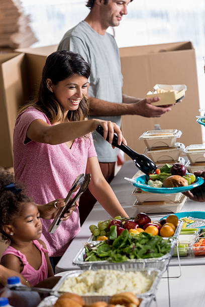 istock Confident Hispanic woman volunteering at soup kitchen 624441734