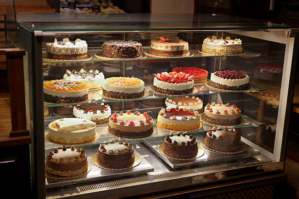 istock Different types of cakes in pastry shop glass display 624443098