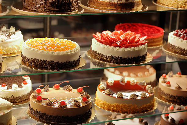 istock Different types of cakes in pastry shop glass display 624443128