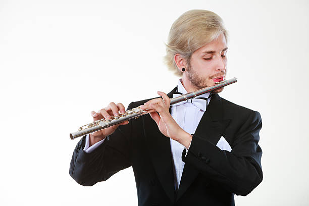 istock Male flutist wearing tailcoat plays flute 624443426