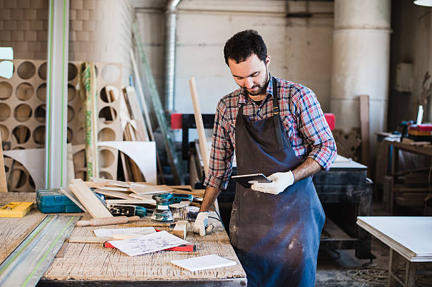 istock Portrait of a carpenter standing in his woodwork studio and 624443474