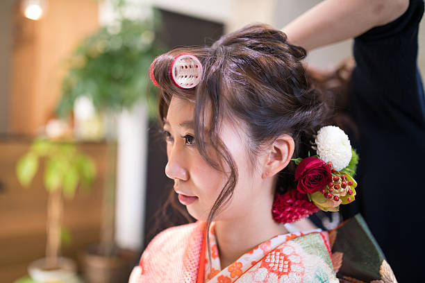 istock Young kimono girl making hair set 624444986