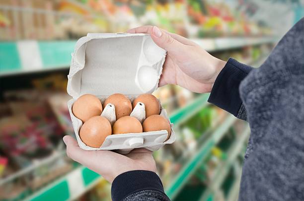 istock Man holding egg box in supermarket 624457508