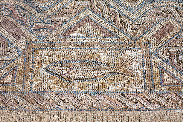 Fragment of ancient religious mosaic Close-up fragment of ancient religious mosaic in Kourion, Cyprus kourion stock pictures, royalty-free photos & images