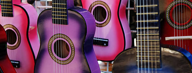 istock Colorful Guitars on Display for Sale 624458230