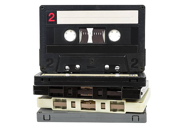 istock Stack of vintage audio tapes on white background 624458894