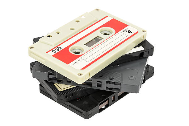 Stack of vintage audio tapes on white background