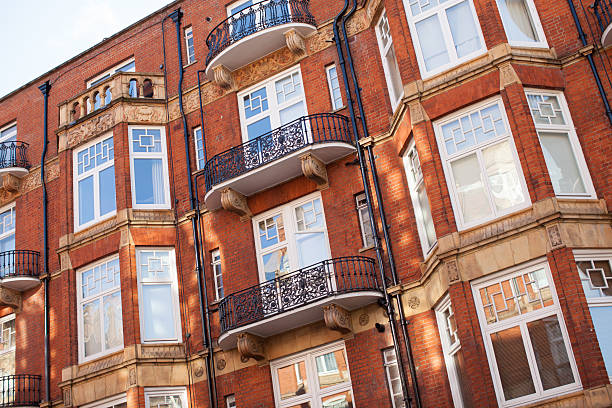 istock Red Brick Apartment Building With Balconies 624461226