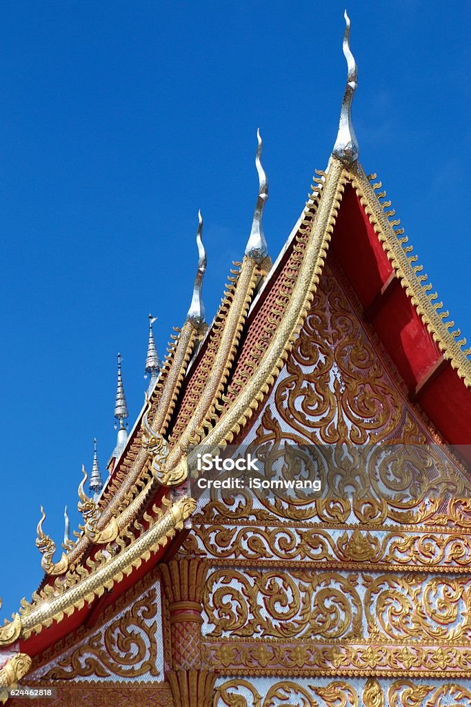 Wat Sri Mongkol Golden Top roof blue sky cloud Wat Sri Mongkol Golden Top roof blue sky cloud Mae Chan Chiang Rai Architecture Stock Photo