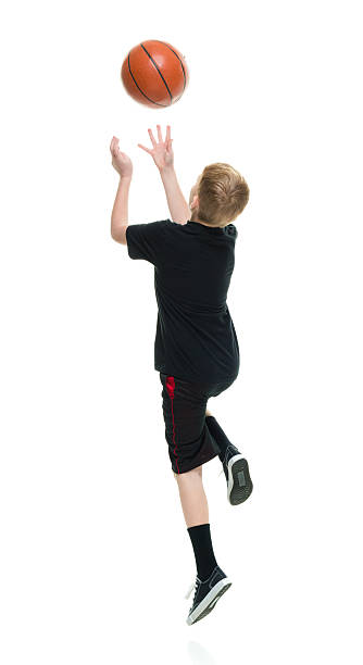 istock Little boy jumping with basketball 624462892