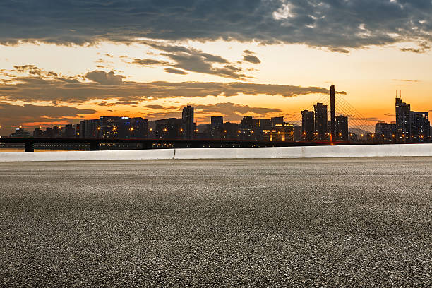 istock Asphalt road and modern city skyline 624472134