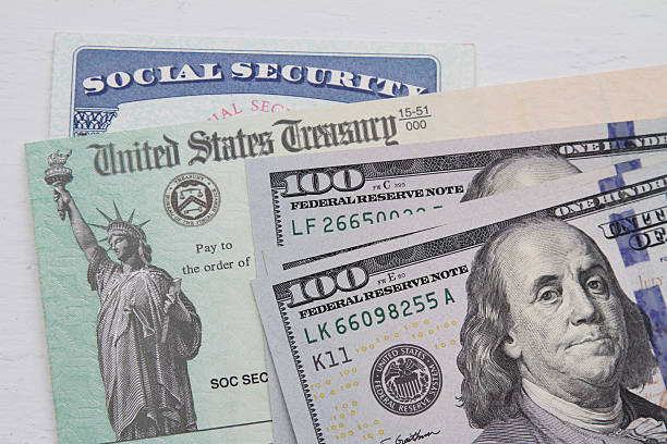 istock Social security card, Treasury check and USA 100 dollar bills 624472982