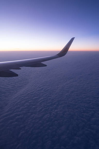 istock Clouds and sky as seen through window of an aircraft 624474230