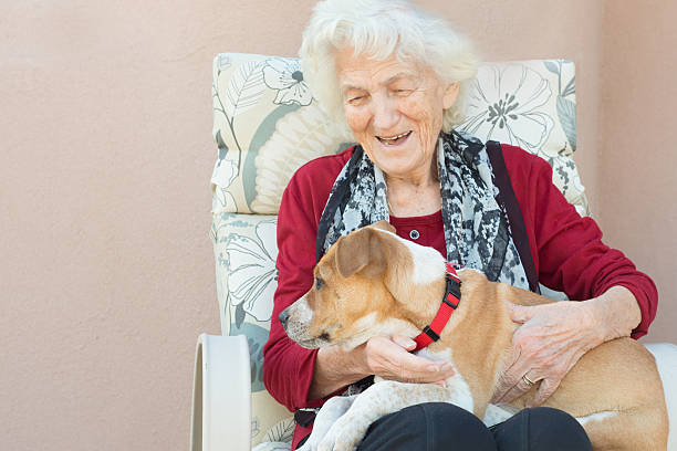istock Senior Woman Loving Dog 624474282