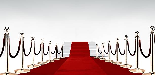 istock Red carpet with stairs at the end over white 624475042