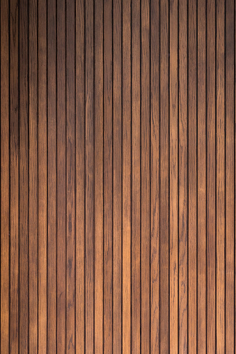 Door made of vertical wooden slats painted in brown