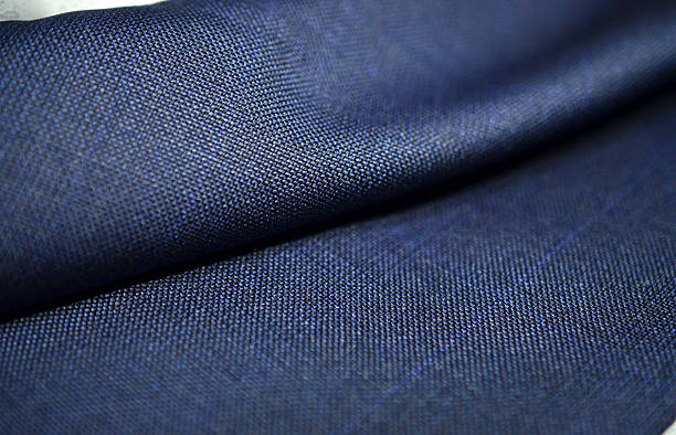 istock close up roll texture blue fabric of suit 624475176