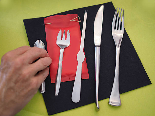 istock Utensils for seafood on a napkin 624477376