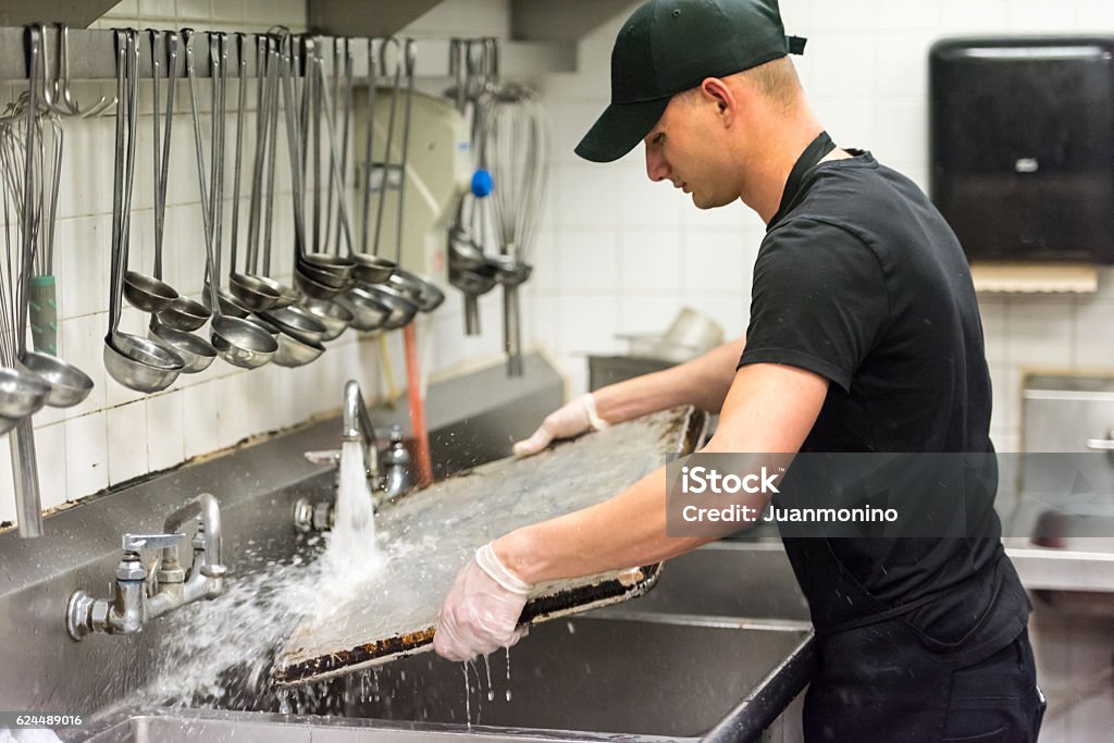 Dishwasher young dishwasher working at a restaurant kitchen Restaurant Stock Photo