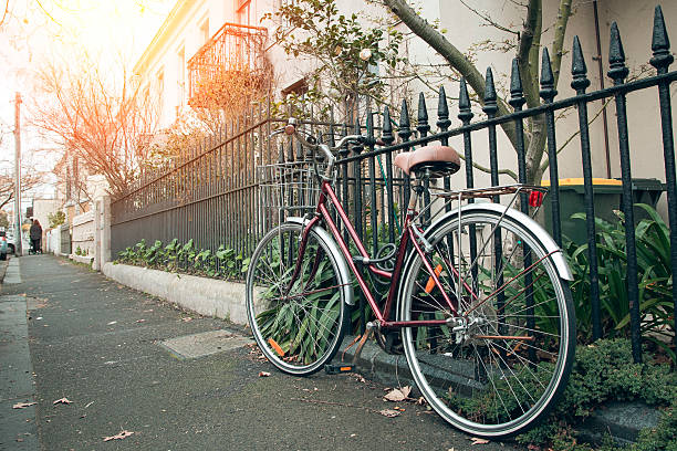 istock classic bicycle at the town with lens flare.Warm toning effect. 624489728