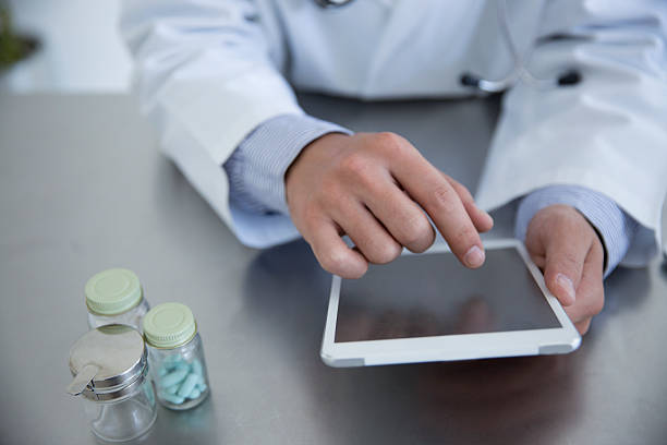 istock Doctor watching tablet at hospital 624490512