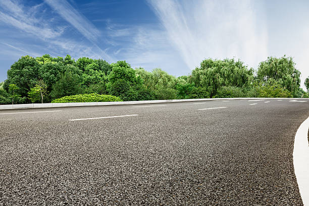 istock New asphalt roads and green woods 624491248