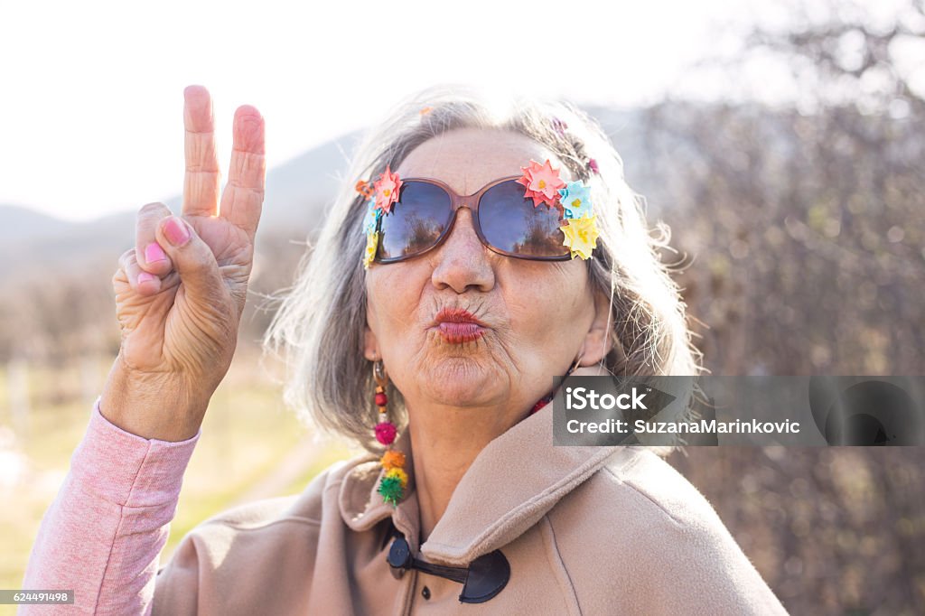 crazy senior woman kissing Bizarre Stock Photo