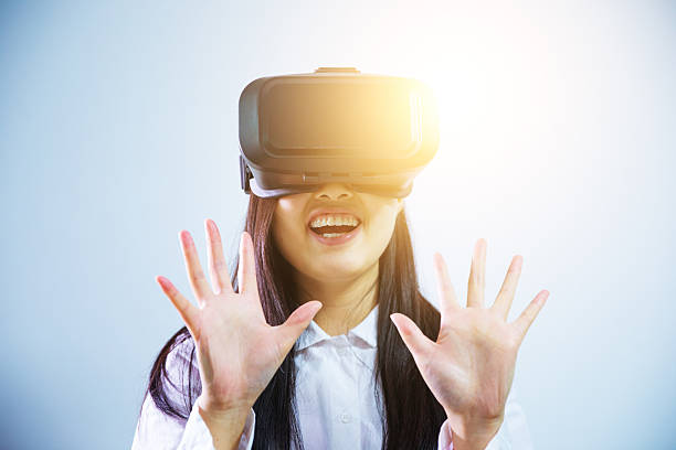 istock Woman wearing virtual reality headset 624491796