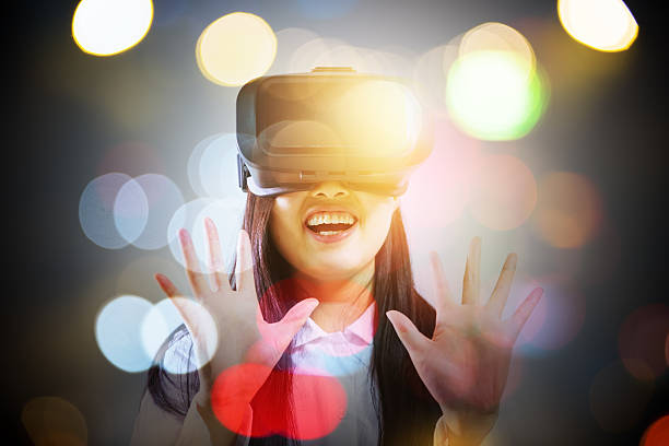 istock Woman wearing virtual reality headset 624491898
