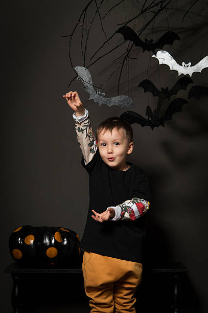 istock little boy on halloween party 624491994